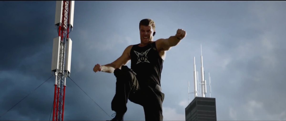 A man mid-action on a rooftop — Shadow Wars film still